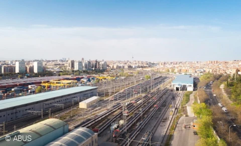 View of train tracks in a large city.